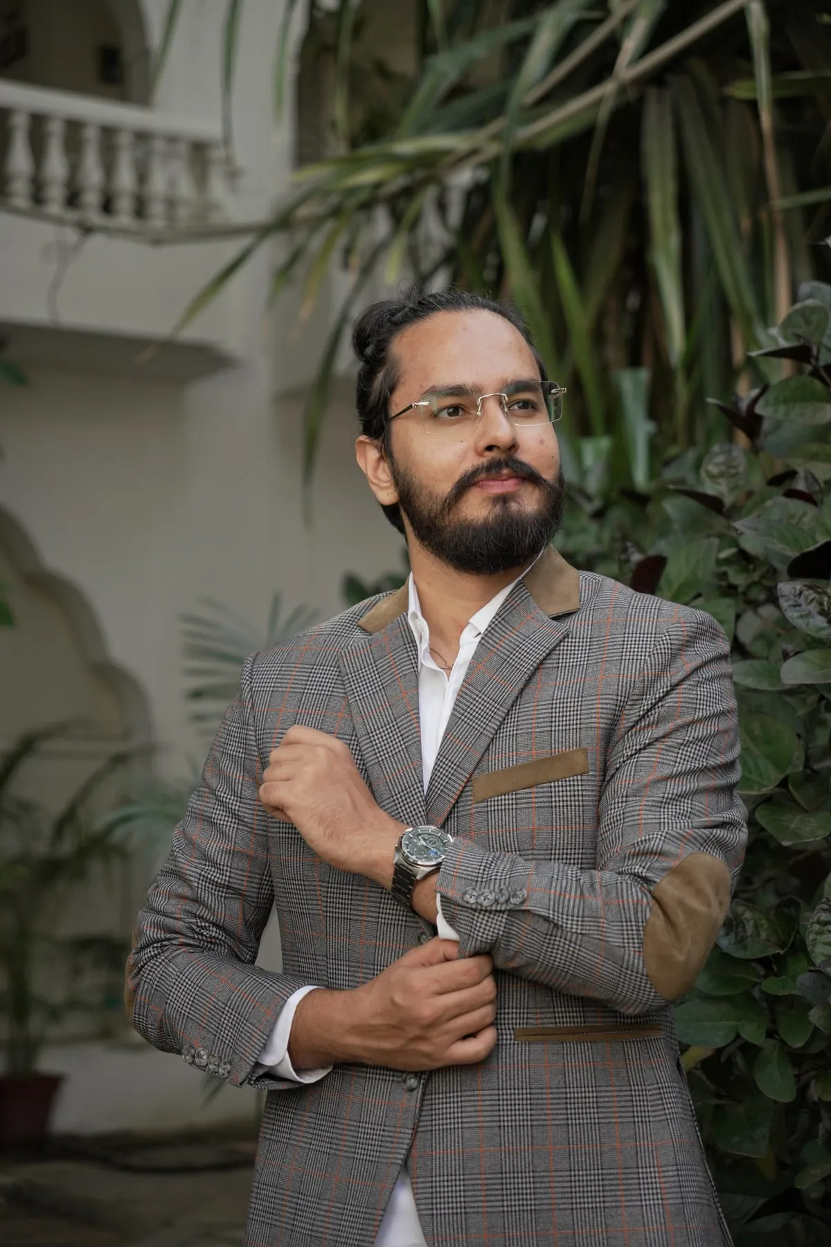 Lokesh Devnani in a blazer, standing outdoors.
